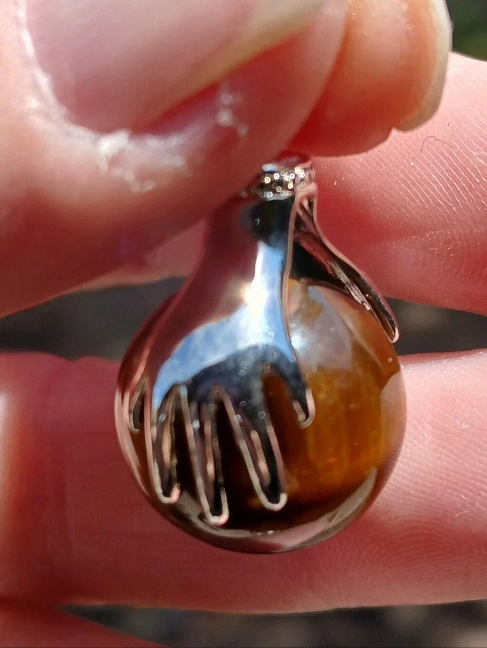 New 18K Hands Holding Tiger Eye Sphere Pendant.